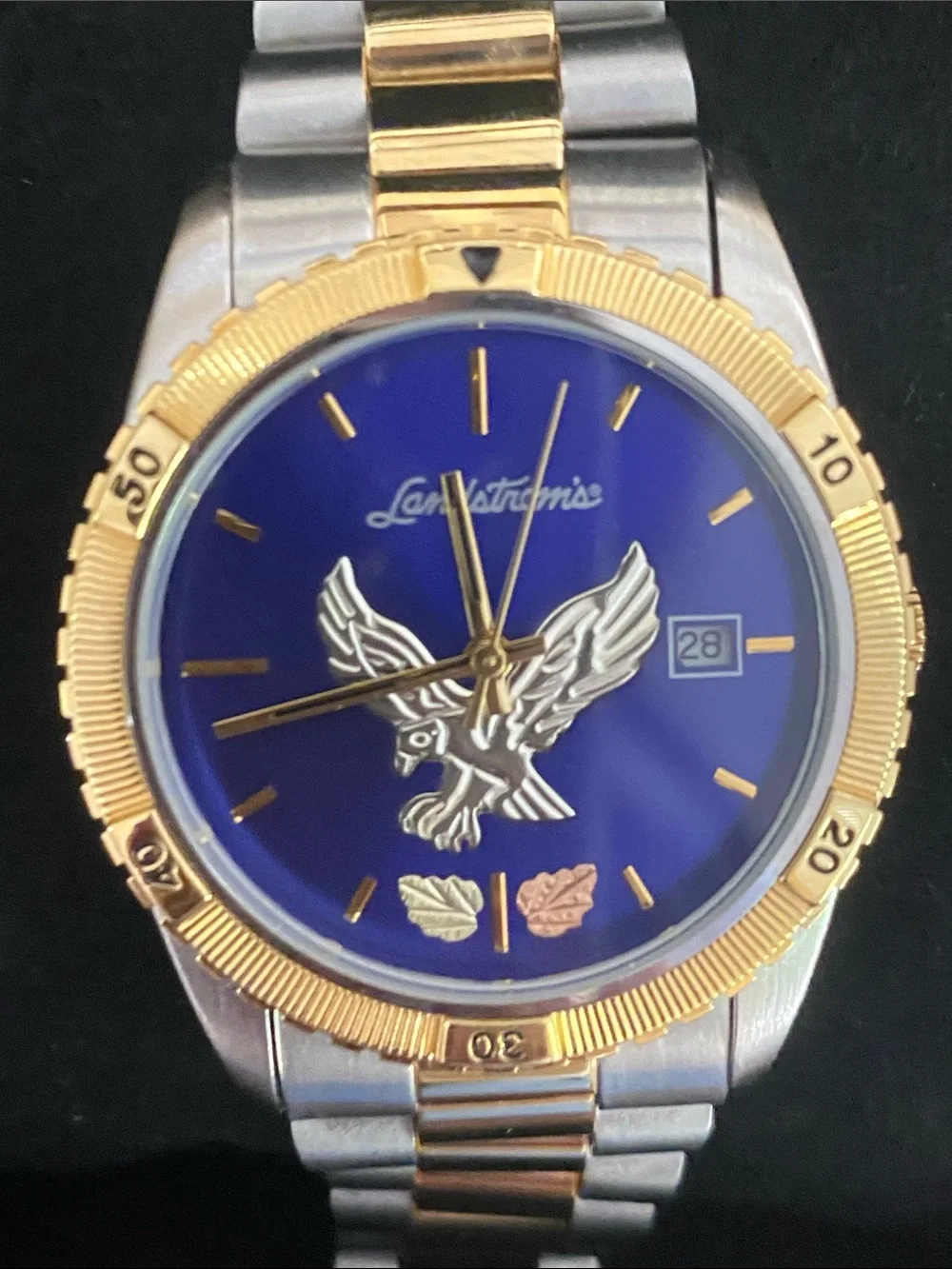 Landstrom’s Black Gold Watch with Blue Dial and Eagle Motif two tone band